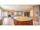 Spacious kitchen with a large island, open to the dining and living areas for easy entertaining at 6046 Bassio Ave, Las Vegas, NV 89141