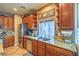 Close-up view of a kitchen with stainless steel appliances and granite countertops at 6046 Bassio Ave, Las Vegas, NV 89141