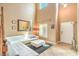 Bright living room with high ceilings, tile flooring, and modern decor at 6046 Bassio Ave, Las Vegas, NV 89141
