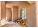 Cozy covered patio with seating, perfect for relaxing and enjoying the outdoors at 6046 Bassio Ave, Las Vegas, NV 89141