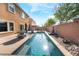 Sparkling swimming pool in a backyard oasis, perfect for outdoor entertaining at 6047 Ancient Peaks Ave, Las Vegas, NV 89141
