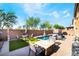 Inviting backyard oasis featuring a swimming pool and outdoor seating area at 6047 Ancient Peaks Ave, Las Vegas, NV 89141