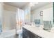 Cozy bathroom features a shower-tub combo, vanity and towel rack at 6047 Ancient Peaks Ave, Las Vegas, NV 89141