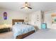 Comfortable bedroom features a custom wood headboard and cool-toned accent furniture at 6047 Ancient Peaks Ave, Las Vegas, NV 89141