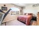 Cozy bedroom featuring natural light, plush carpeting, and a comfortable bed at 6047 Ancient Peaks Ave, Las Vegas, NV 89141