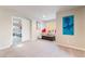 Open bonus room featuring cozy seating and a doorway to a bedroom at 6047 Ancient Peaks Ave, Las Vegas, NV 89141