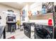 Laundry room with washer, dryer, shelving, decor and an arcade machine at 6047 Ancient Peaks Ave, Las Vegas, NV 89141