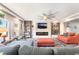 Cozy living room with a fireplace, comfortable seating, and stylish decor at 6047 Ancient Peaks Ave, Las Vegas, NV 89141