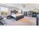Spacious main bedroom with a tray ceiling, neutral color palette, and carpet at 6047 Ancient Peaks Ave, Las Vegas, NV 89141