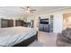 Main bedroom featuring a seating area, a closet, natural lighting, and carpet at 6047 Ancient Peaks Ave, Las Vegas, NV 89141