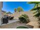 This backyard boasts desert landscaping, a gravel area, a seating area, and an outdoor grill at 6236 Desert Haven Rd, Las Vegas, NV 89130