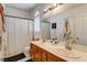 Bright bathroom with double sinks, a shower-tub combo, and ample counter space at 6236 Desert Haven Rd, Las Vegas, NV 89130