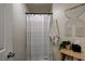 This well-lit bathroom includes a shower with a stylish curtain, adding a touch of elegance to the space at 6236 Desert Haven Rd, Las Vegas, NV 89130