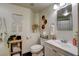 Bright bathroom featuring a vanity, toilet, and decorative elements, creating a cozy and stylish space at 6236 Desert Haven Rd, Las Vegas, NV 89130