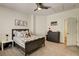 Cozy bedroom features a ceiling fan, neutral colors, and comfortable decor at 6236 Desert Haven Rd, Las Vegas, NV 89130