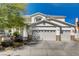 Charming two-story home featuring a three-car garage, and decorative stone accents at 6236 Desert Haven Rd, Las Vegas, NV 89130
