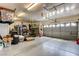 Spacious garage with multiple car spaces, storage, and organization racks at 6236 Desert Haven Rd, Las Vegas, NV 89130