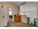 This upstairs hallway features a storage cabinet, staircase, and partial view into an adjacent bedroom at 6236 Desert Haven Rd, Las Vegas, NV 89130