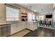 Stylish kitchen with modern appliances, breakfast bar, and abundant natural light at 6236 Desert Haven Rd, Las Vegas, NV 89130