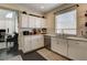 Well-lit kitchen with stainless steel appliances, mosaic backsplash, and eat in breakfast nook with great natural light at 6236 Desert Haven Rd, Las Vegas, NV 89130
