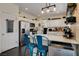 Charming kitchen with stainless appliances, breakfast bar, and stylish decor at 6236 Desert Haven Rd, Las Vegas, NV 89130