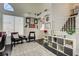 Bright living room with stylish furnishings and staircase, perfect for relaxing and entertaining at 6236 Desert Haven Rd, Las Vegas, NV 89130