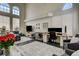 Spacious living room with high ceilings, natural light, and a dedicated workspace at 6236 Desert Haven Rd, Las Vegas, NV 89130