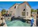 Gorgeous backyard showcasing a stunning pool with waterfall feature, sun loungers, and a recreational space at 6236 Desert Haven Rd, Las Vegas, NV 89130