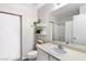 Bright bathroom with floating shelves, stylish decor and a large mirror over the vanity at 6299 Oread Ave, Las Vegas, NV 89139