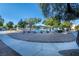 Community pool with a gazebo surrounded by a white metal fence and desert landscaping at 6299 Oread Ave, Las Vegas, NV 89139