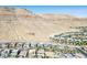 Scenic aerial view of the neighborhood nestled against a beautiful mountain backdrop at 6433 Farness St, Las Vegas, NV 89135