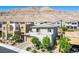 Areal view of home surrounded by lush trees with mountain views at 6433 Farness St, Las Vegas, NV 89135