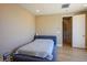 Neutral bedroom featuring a platform bed and wood-look flooring at 6433 Farness St, Las Vegas, NV 89135
