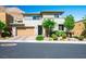 Charming two-story home with desert landscaping, complemented by a brick driveway at 6433 Farness St, Las Vegas, NV 89135
