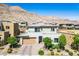 Stunning two-story home featuring desert landscaping and a mountain backdrop at 6433 Farness St, Las Vegas, NV 89135