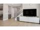 Living area with a media center, staircase, and modern decor, blending style and functionality for everyday living at 6433 Farness St, Las Vegas, NV 89135