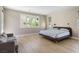 Spacious main bedroom with a seating area and big windows to bring in light and fresh air at 6433 Farness St, Las Vegas, NV 89135