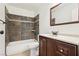 Bathroom features a shower-over-tub with tile surround and dark wood vanity at 6711 W Charleston Blvd # 4, Las Vegas, NV 89146