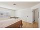 Bedroom with wood-look floors, neutral walls and a window with blinds at 6711 W Charleston Blvd # 4, Las Vegas, NV 89146