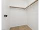 Walk-in closet with wood-look floors, white walls and shelving at 6711 W Charleston Blvd # 4, Las Vegas, NV 89146