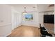 Dining space with wood floors, wainscoting and a modern chandelier at 6711 W Charleston Blvd # 4, Las Vegas, NV 89146
