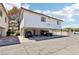 Multi-Gathering home featuring private parking below unit and white stucco exterior, complemented by a red tile roof at 6711 W Charleston Blvd # 4, Las Vegas, NV 89146