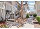 Charming condo exterior with landscaped grounds and stairway access to upper units at 6711 W Charleston Blvd # 4, Las Vegas, NV 89146