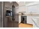 Close-up of a modern black refrigerator, granite countertops and modern appliances at 6711 W Charleston Blvd # 4, Las Vegas, NV 89146