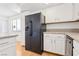 Eat-in kitchen features a black refrigerator, white cabinets and granite counters at 6711 W Charleston Blvd # 4, Las Vegas, NV 89146