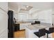 Well-lit kitchen with granite counters, white cabinets, and modern appliances at 6711 W Charleston Blvd # 4, Las Vegas, NV 89146