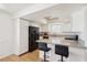 Modern kitchen featuring granite countertops, a breakfast bar, and stainless steel appliances at 6711 W Charleston Blvd # 4, Las Vegas, NV 89146