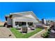 Inviting backyard oasis with a patio, hot tub, and well-manicured landscaping at 689 Moonstone Beach Pl, Henderson, NV 89011