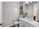 Elegant powder room with modern fixtures, stylish vanity, and decorative accents at 689 Moonstone Beach Pl, Henderson, NV 89011