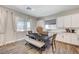 Bright dining area featuring a rustic table, bench seating, and modern decor at 689 Moonstone Beach Pl, Henderson, NV 89011